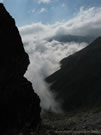 Image of clouds pouring into the valley, Mondaca Trail, Chile.